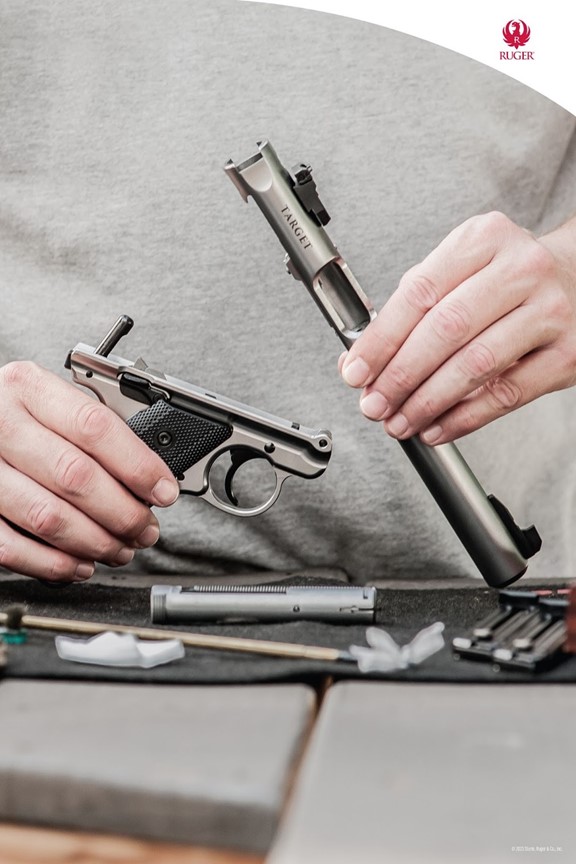 Person taking apart gun to clean